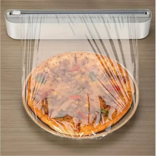 Compact white cling film dispenser box holding a round food wrap roll