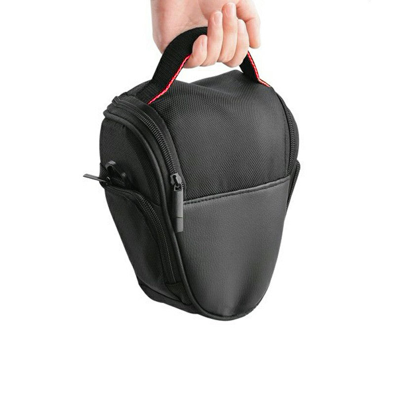 Camera lens shoulder case bag, black with red trim, front zipper and hand-held carry.