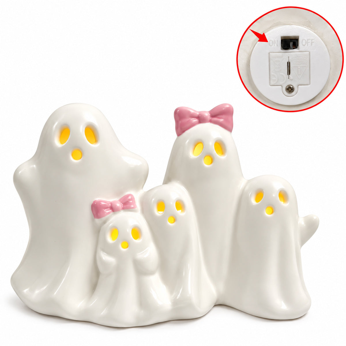 Ceramic LED ghost figurine set with glowing eyes; inset shows battery compartment and switch