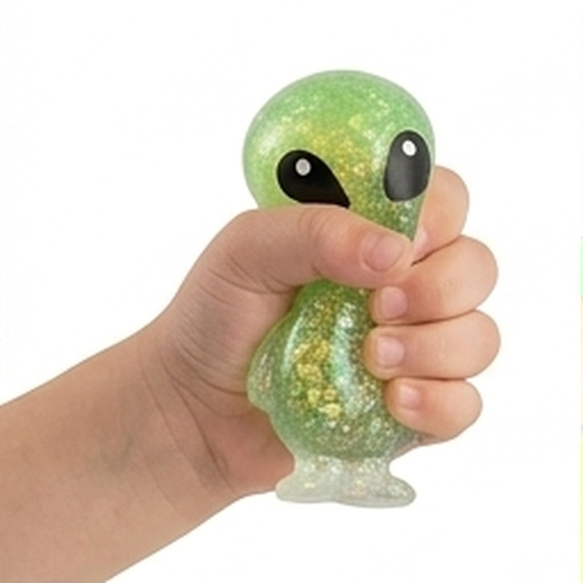 Green glitter alien sensory squeeze toy held in hand