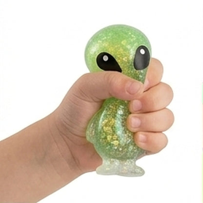 Green glitter alien sensory squeeze toy held in hand