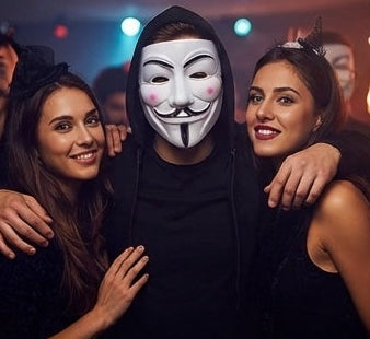 Guy Fawkes Anonymous mask worn at party, white face with black moustache and nose