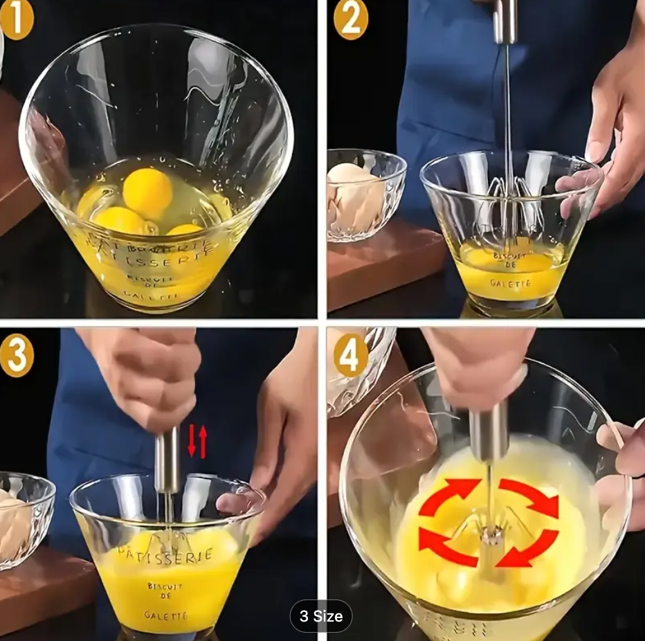 Stainless steel manual whisk beater stirring yellow batter in a bowl