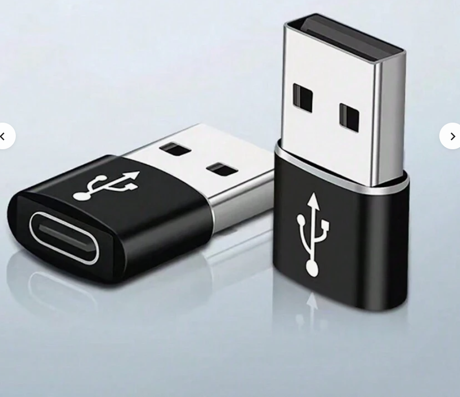 USB-A to Type-C adapter with black body and silver metal connectors, on reflective surface