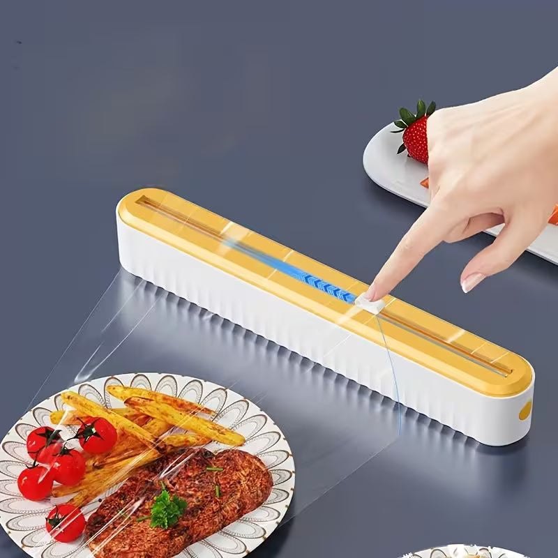 White and yellow dispenser with open lid, cutting slot and clear film being pulled