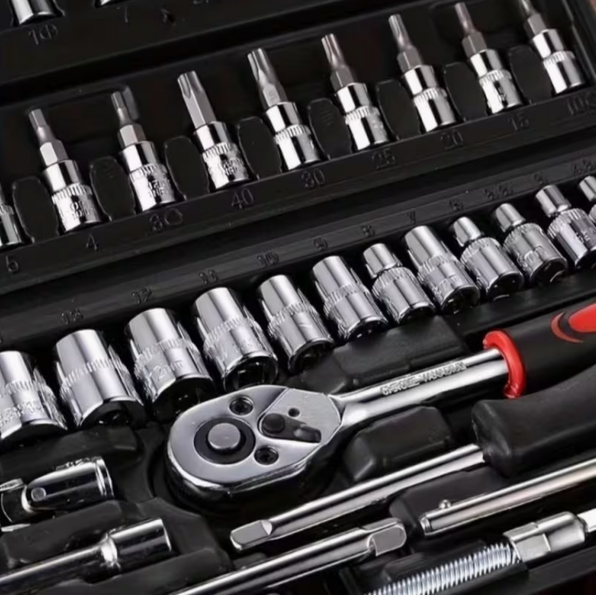 Socket set in black tray with chrome sockets and ratchet tool with red accents