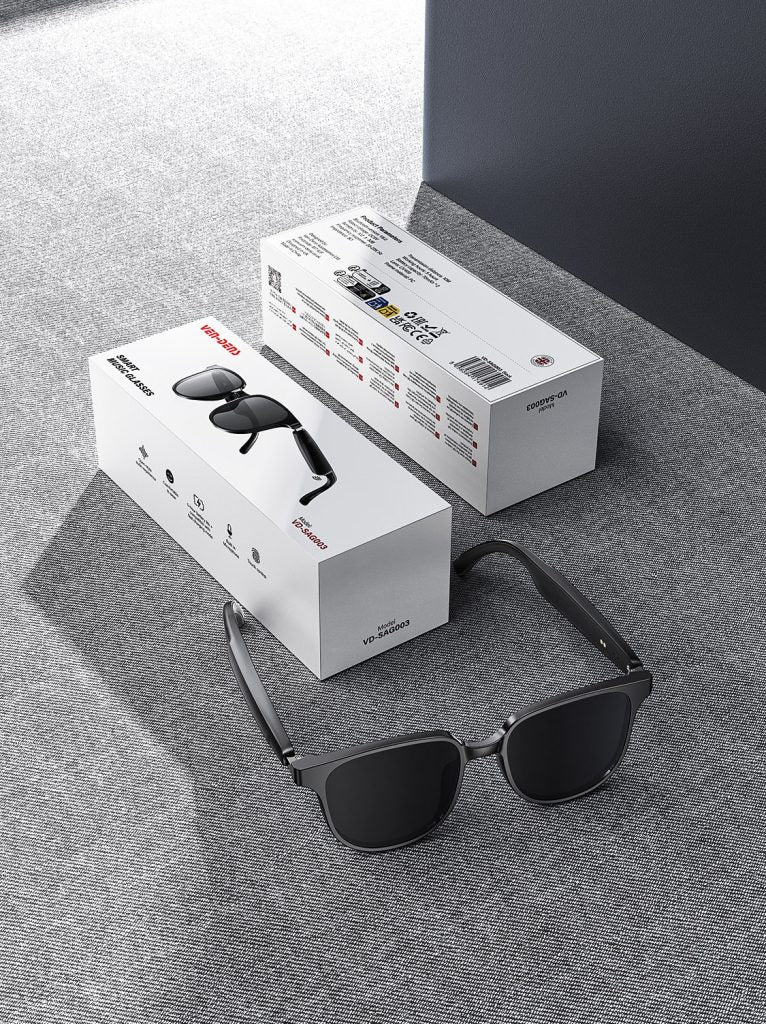 Black aviator Bluetooth audio sunglasses with open-ear design shown with product boxes