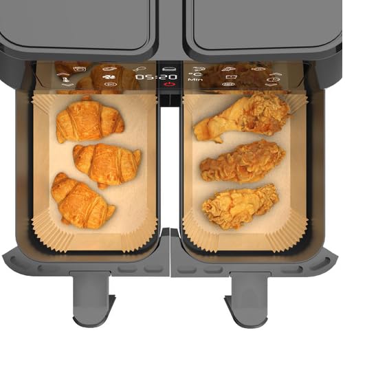 Dual air fryer basket liners with ridged tan paper, fitted in both compartments