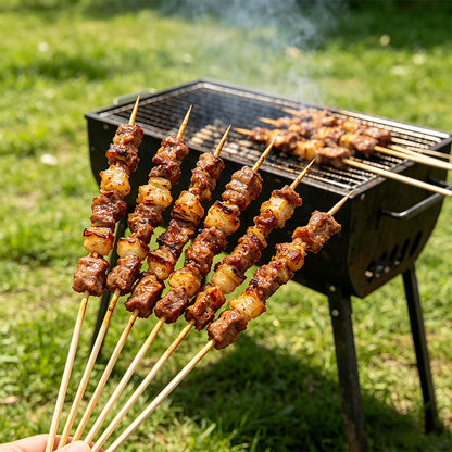 Row of grilled meat skewers on a barbecue grill with long wooden handles