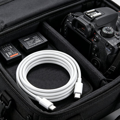 White USB-C to USB-C cable coiled inside a case