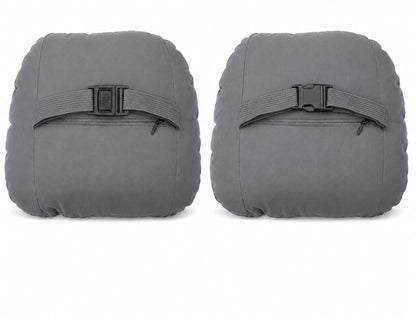 Pair of grey car headrest neck support cushions with adjustable strap buckles, rear view