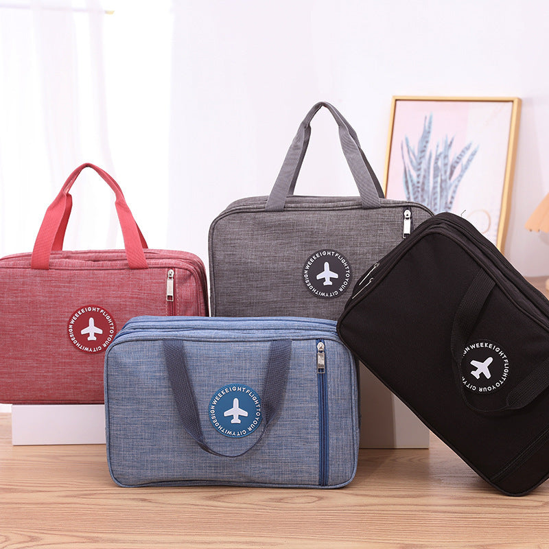 Assorted wet and dry toiletry bags in red, gray, blue, and black with zipper handles.