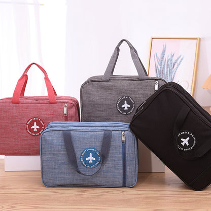 Assorted wet and dry toiletry bags in red, gray, blue, and black with zipper handles.
