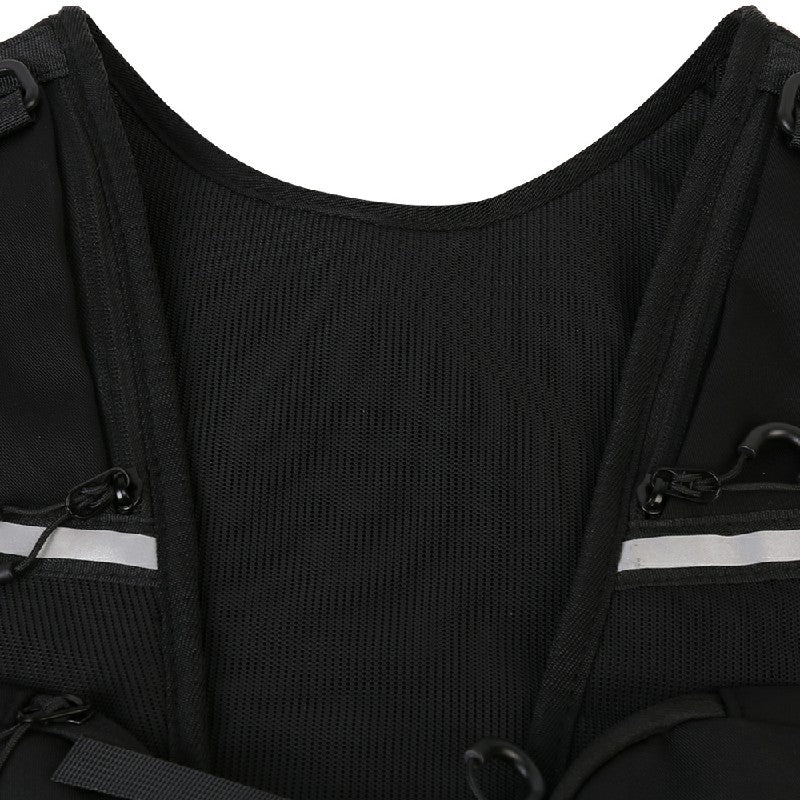 Black hydration vest chest panel with reflective stripe and top fastening straps