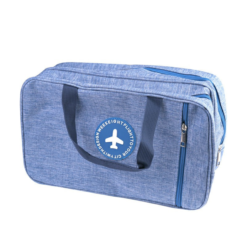 Light blue toiletry wash bag with top zip pocket and side zipper pull