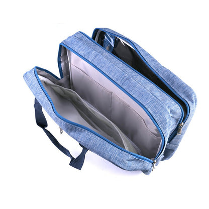 Blue wet and dry toiletry bag open with zip top and inner divider pockets.