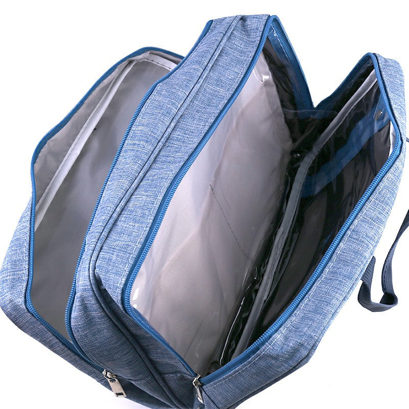 Blue wet and dry toiletry bag open angle, showing wipeable lining and compartments.