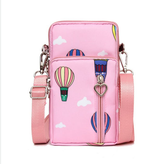 Pink mini cross-body phone bag with zipper, colorful hot-air balloon print