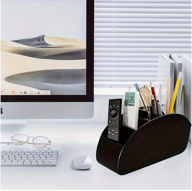 Black acrylic 5-compartment desk organizer with curved front, holding remote and pens