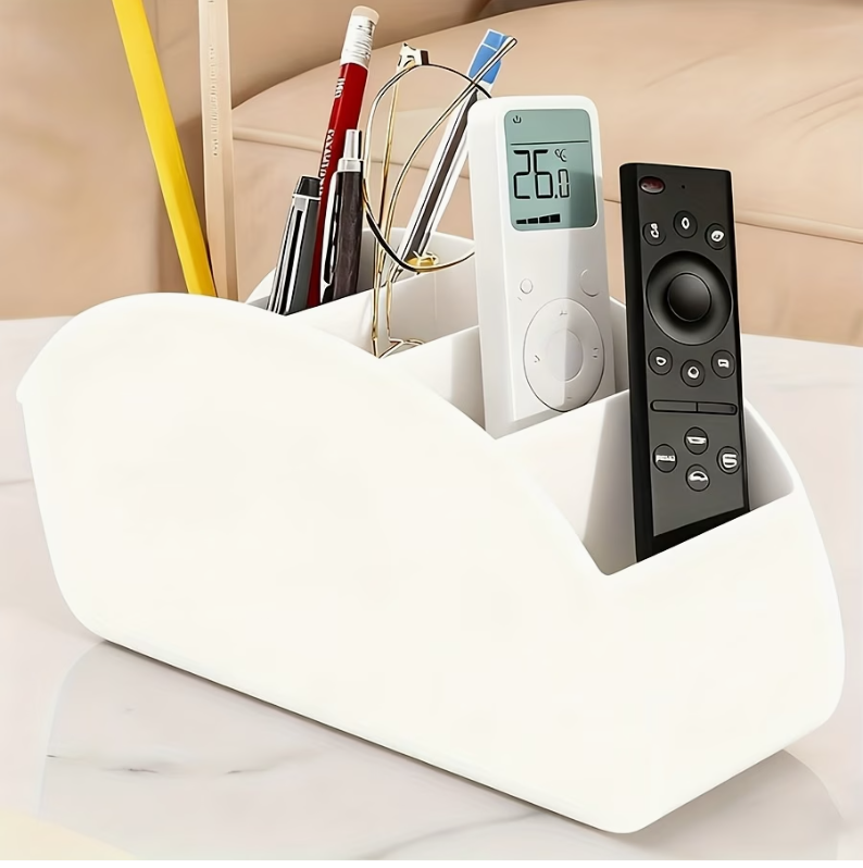 White acrylic 5-compartment desk organizer with curved shape, holding pens and remote