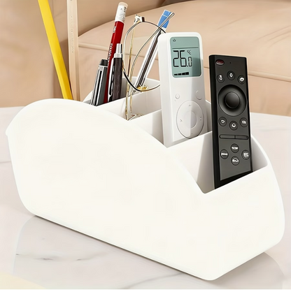 White acrylic 5-compartment desk organizer with curved shape, holding pens and remote