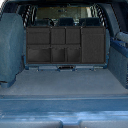 Black seat-back hanging storage organizer with multiple front compartments and zippered panels