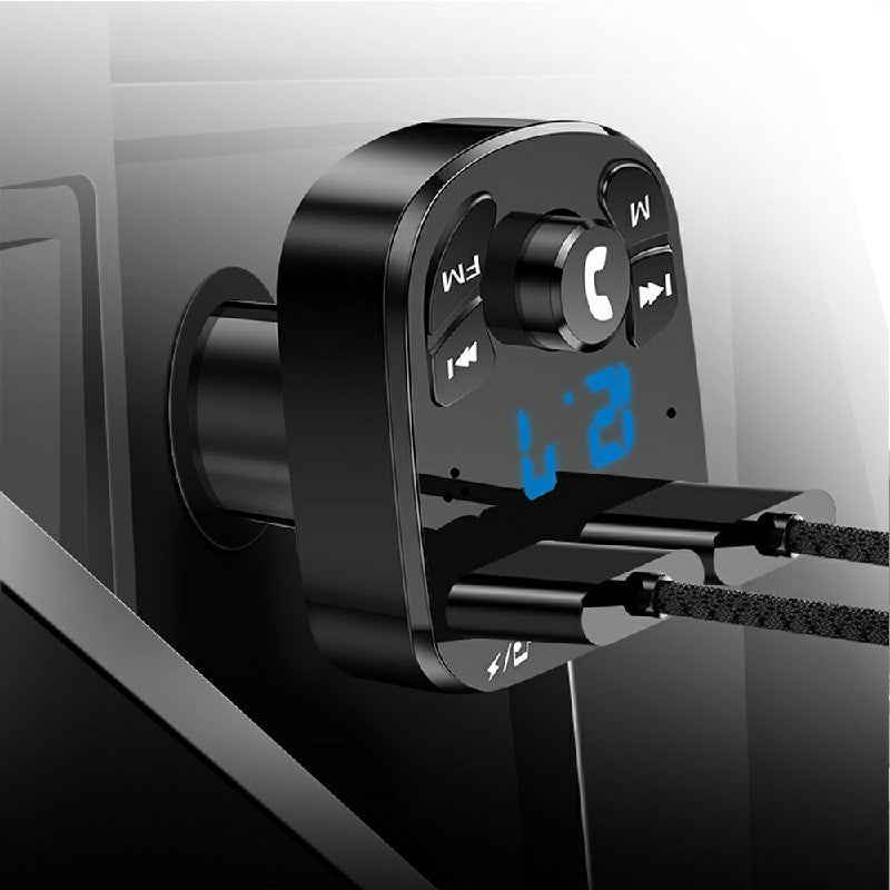 Car Bluetooth FM transmitter with USB connector in car port, blue LED display visible
