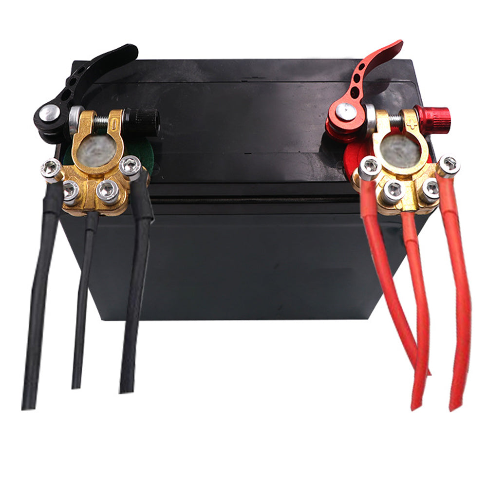 Battery terminal clamps mounted on a black battery box with red cables