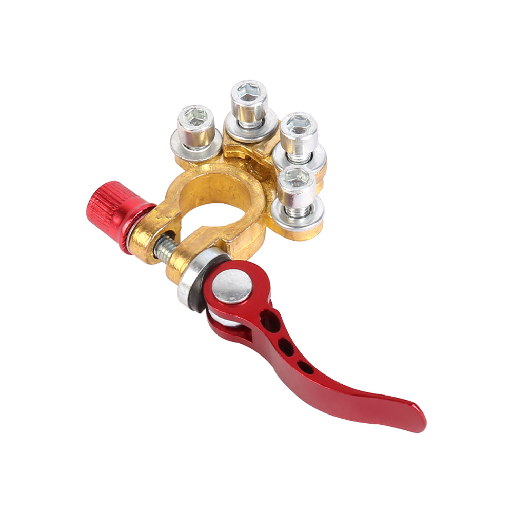Battery terminal clamp with red lever, gold brass base, and multiple silver posts