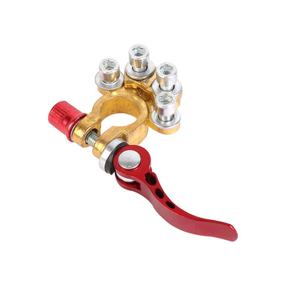 Battery terminal clamp with red lever, gold brass base, and multiple silver posts