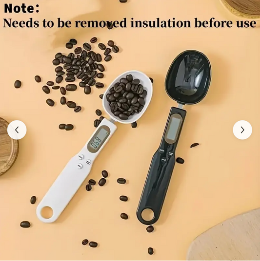 Digital kitchen spoon scale on orange background with coffee beans, white scoop