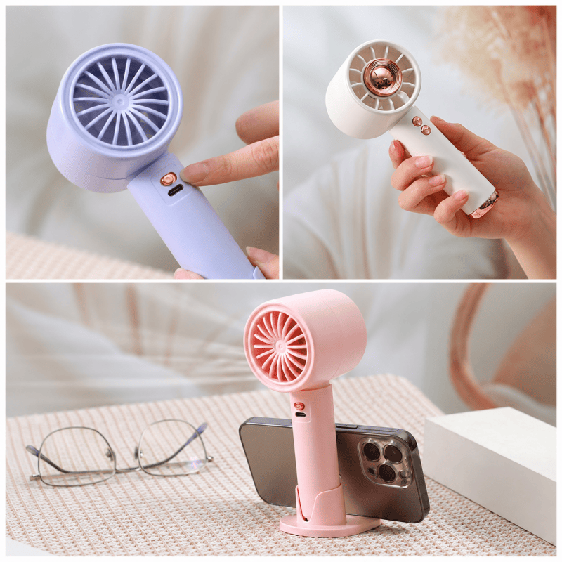 Purple handheld mini fan with finger control and phone stand position