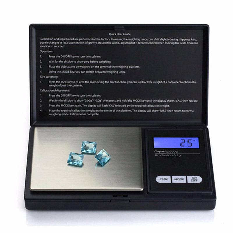Digital pocket mini jewellery weighing scale showing 25g on display with metal platform and gems