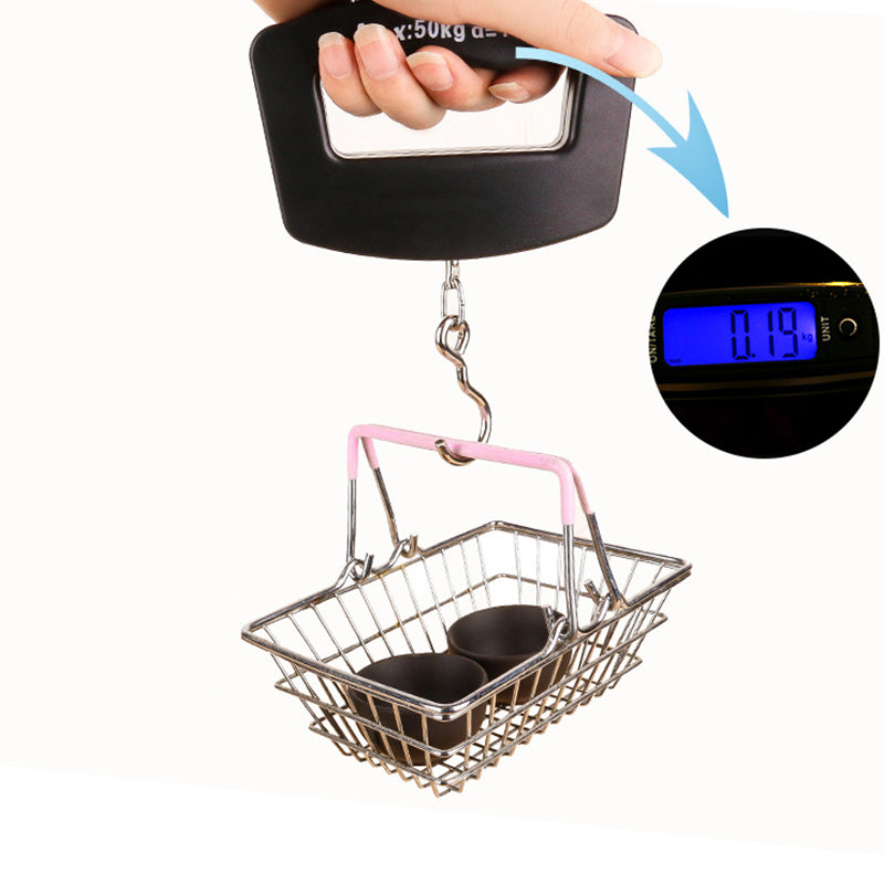 Luggage weighing scale attached to wire basket, with pink handle and digital display