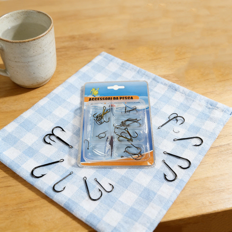 Assorted fishing hooks blister pack with multiple black hooks on blue cloth
