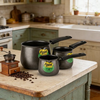 Three Turkish-style tea pots with black long handles and speckled steel finish