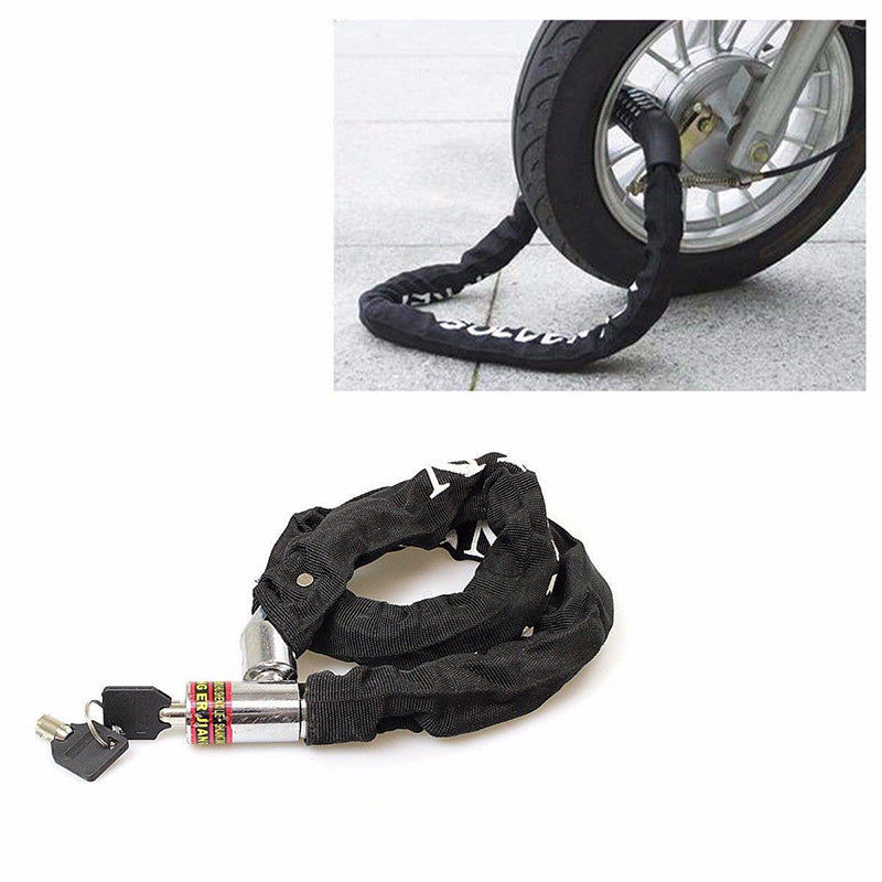 Black fabric-covered bicycle chain lock with keys, looped around a bike wheel