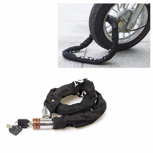 Black fabric-covered bicycle chain lock with keys, looped around a bike wheel