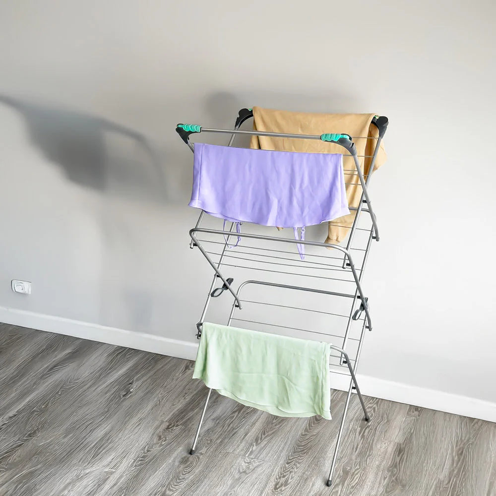 3-tier foldable clothes airer with purple and mint drying cloths