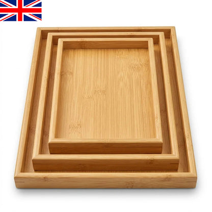 Nested square bamboo serving trays with light wood finish, top view