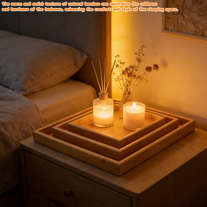 Bamboo serving tray with raised rim holding candles on nested trays