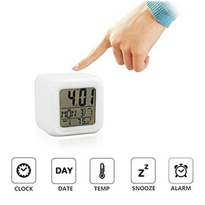 White cube LED digital alarm clock with feature icons and time display