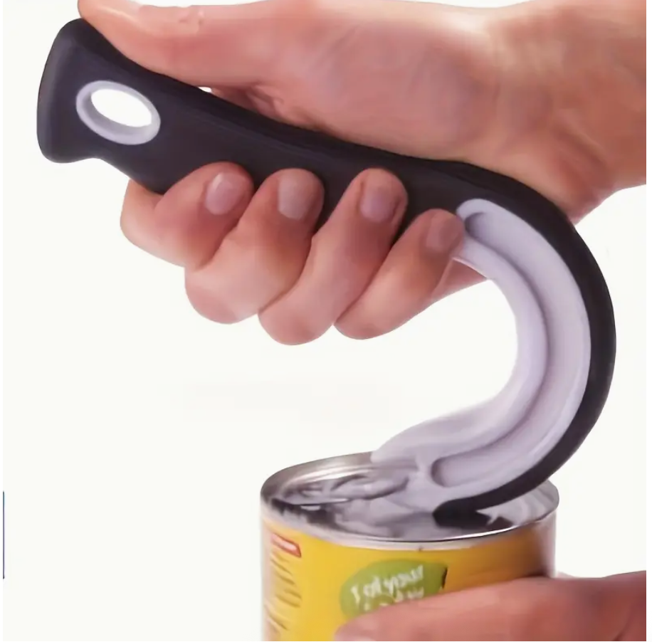 Black can opener with white curved hook in a hand, poised over can lid.