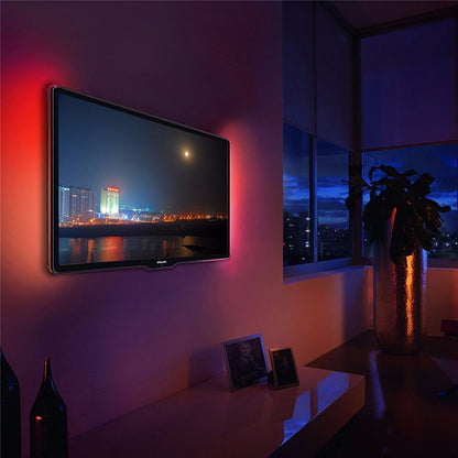 Wall-mounted TV with glowing RGB LED backlight along the screen border