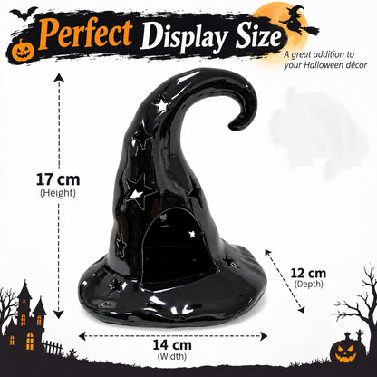 Black ceramic witch hat candle holder with star cut-outs and curved top