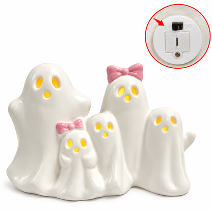 Ceramic LED ghost figurine set with glowing eyes; inset shows battery compartment and switch
