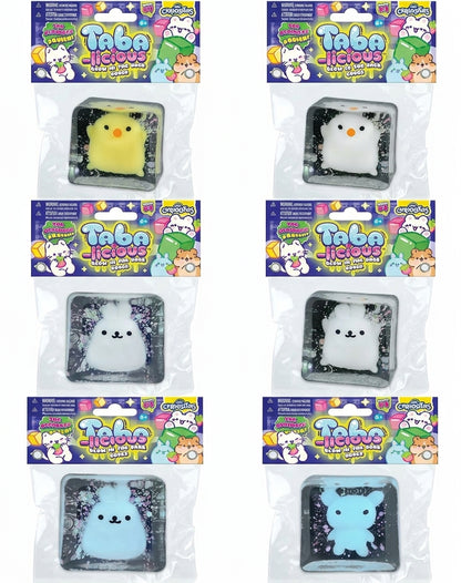 Assorted glow-in-the-dark squishy animal toys in sealed retail packages