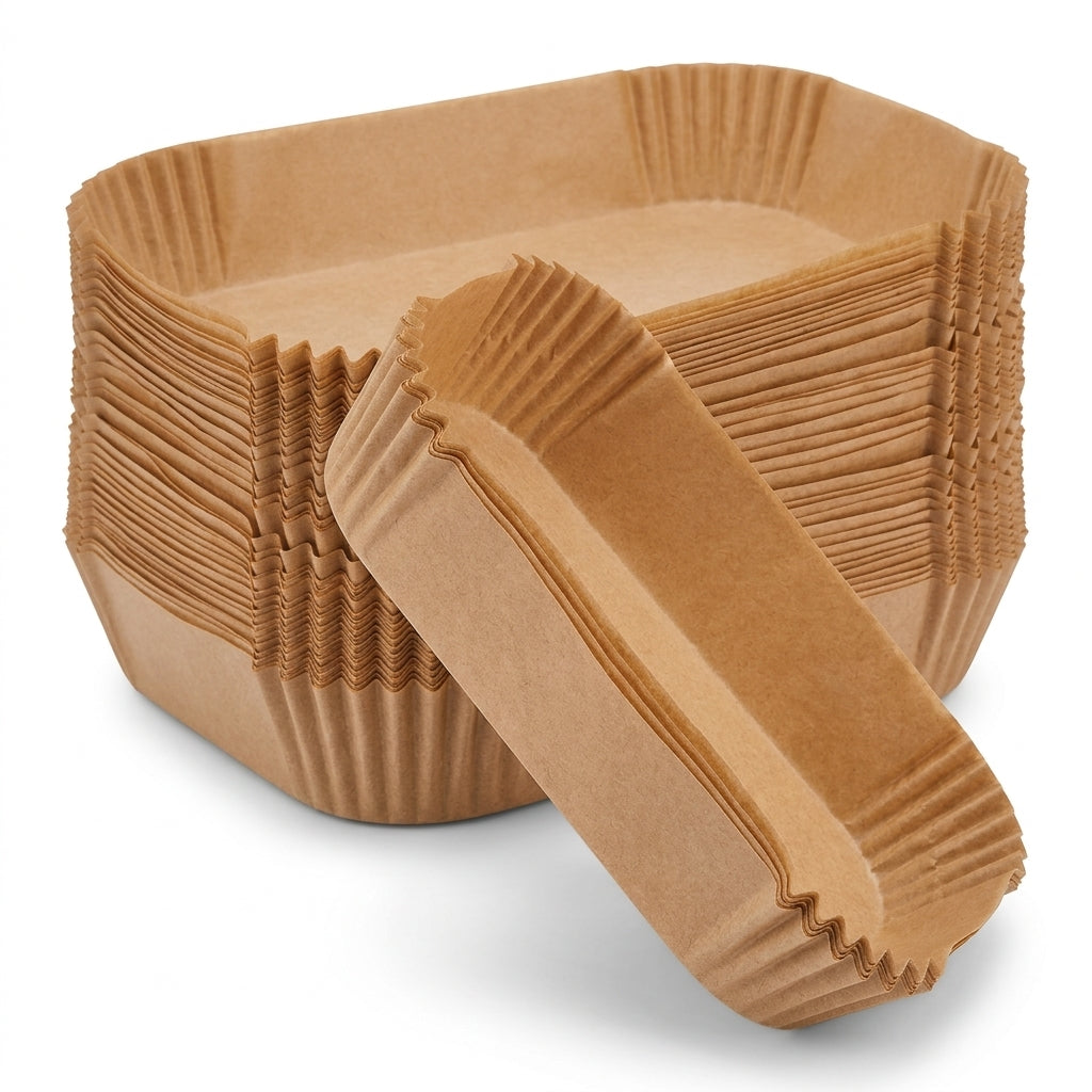 Stack of disposable rectangular air fryer liners, brown paper, ridged crimped rims
