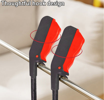 Litter grabber claw with red rubber pads and wide black hooks for gripping objects