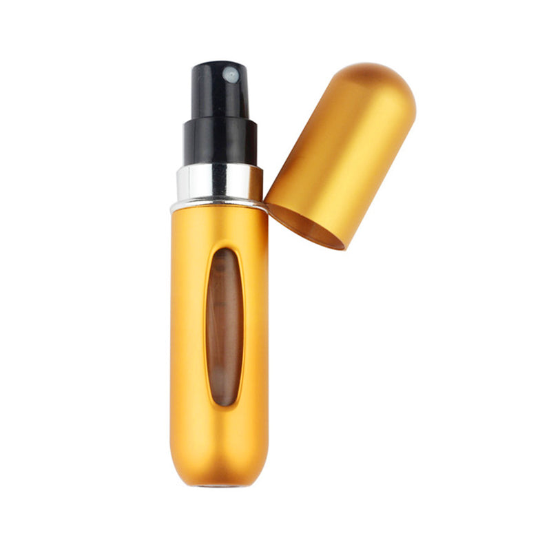 Gold mini perfume spray bottle with black pump top and open nozzle spray